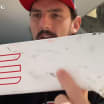 Connor Hellebuyck shows off stick from gold medal game save