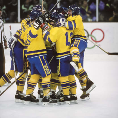 Sweden celebrates a goal against the USA in the first round of the Ice Hockey tournament of the 1992 Winter Olympic Games on February 17, 1992 at the Meribel Ice Palace in Meribel, France; visible players include Borje Salming #21, Hakan Loob #12. (Photo by David Madison/Getty Images)