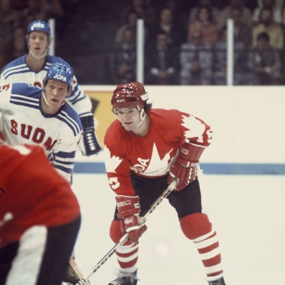 Marcel Dionne #15 of team Canada looks on against Heikki Riihiranta #5 of team Finland during a Canada Cup game held at the Ottawa Civic Centre on September 2, 1976 in Ottawa, Canada. (Photo by Denis Brodeur/NHLI via Getty Images)