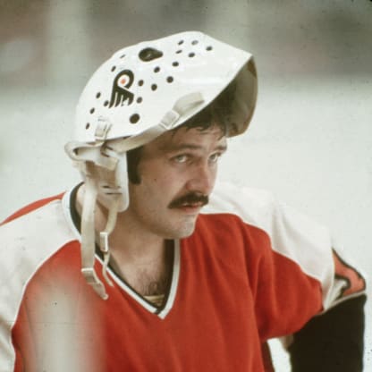 1970s: Canadian professional goalie Bernie Parent of the Philadephia Flyers stands on the ice with his face mask flipped up on his head during a 1970s NHL road game. Parent played for the Flyers from 1967-71, then returniing to complete his career with the Flyers from 1973-79. (Photo by Bruce Bennett Studios via Getty Images Studios/Getty Images)