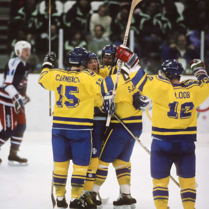 Sweden celebrates a goal against the USA in the first round of the Ice Hockey tournament of the 1992 Winter Olympic Games on February 17, 1992 at the Meribel Ice Palace in Meribel, France; visible players include Patrik Carnback #15, Hakan Loob #12.. (Photo by David Madison/Getty Images)