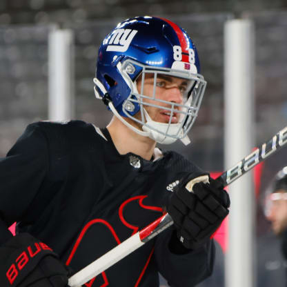 Devils defenseman Bahl wears Giants helmet at Stadium Series skate