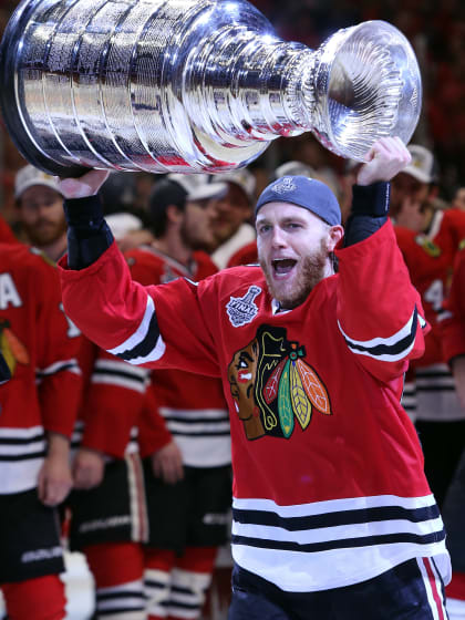Patrick Kane #88 of the Chicago Blackhawks celebrates by hoisting the Stanley Cup after defeating the Tampa Bay Lightning by a score of 2-0 in Game Six to win the 2015 NHL Stanley Cup Final at the United Center on June 15, 2015 in Chicago, Illinois. (Photo by Tasos Katopodis/Getty Images)