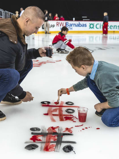 Devils Fans Paint the ice