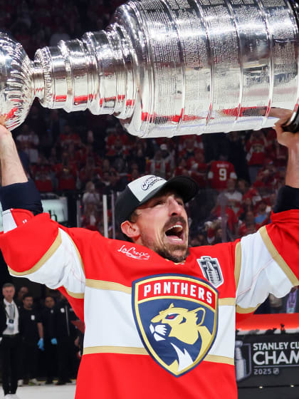 Brad Marchand lifts Stanley Cup again after 14 years