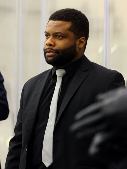 Color of Hockey Zack Dailey climbing coaching ladder with MacEwan University