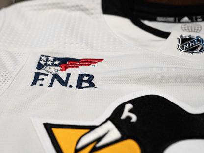 Bruins unveil first-ever jersey patch sponsor