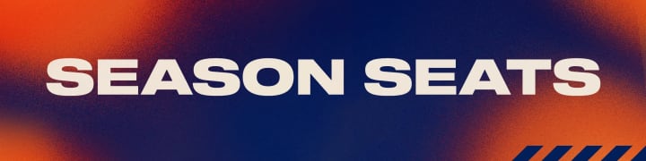 A modern promotional graphic with a gradient background from deep blue to vibrant orange. The bold, white, centered text reads “SEASON SEATS.” Three dark orange diagonal stripes are in the lower right corner.