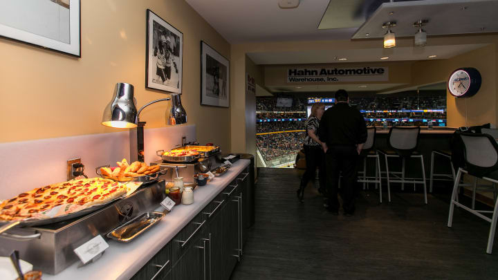 Photo from inside one of key bank center's suites, shows some of the food options provided in the suites including pepperoni Pizza