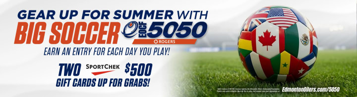 Big Soccer 50/50 promotional banner showing a soccer ball made of world flags on a grass field with contest text about daily entries, Sport Chek $500 gift cards, and Edmonton Oilers Community Foundation raffle details.