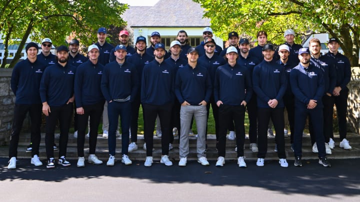 Photo of large group of Blue Jackets players posing for a photo at Double Eagle Golf Club during the annual Blue Jackets Foundation Golf Classic.
