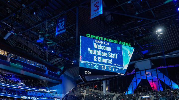 message on twin video boards at climate pledge arena