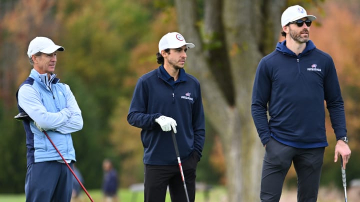 Photo of Johnny Gaudreau and Erik Gudbranson on the golf course at Double Eagle with another participant in the Columbus Blue Jackets Foundation Golf Classic.