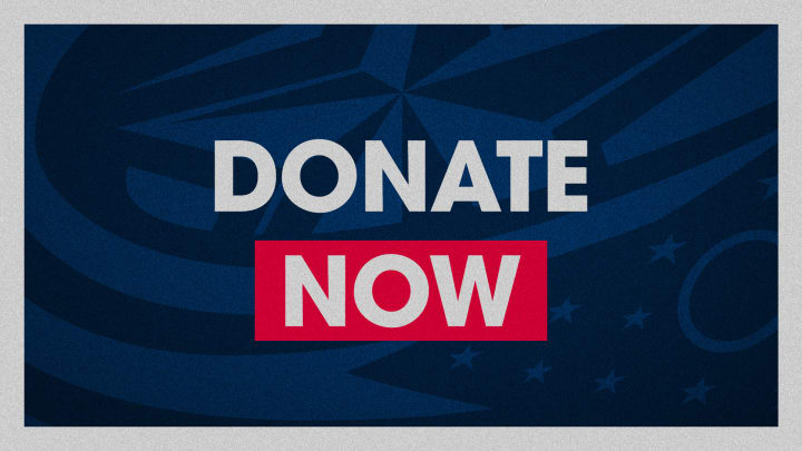 Blue graphic with grey border. Large grey text at center reads Donate Now.