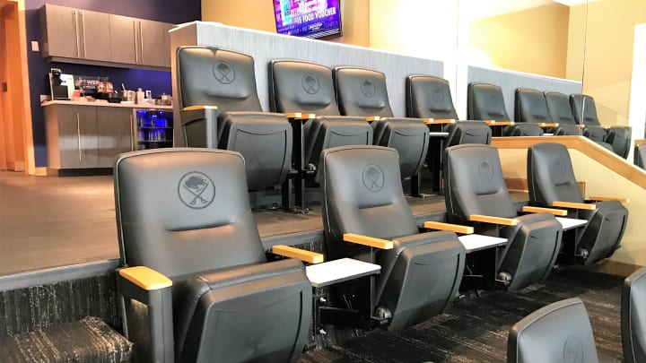 Photo from inside one of key bank center's suites featuring the suite's leather seats with the Sabres logo on them