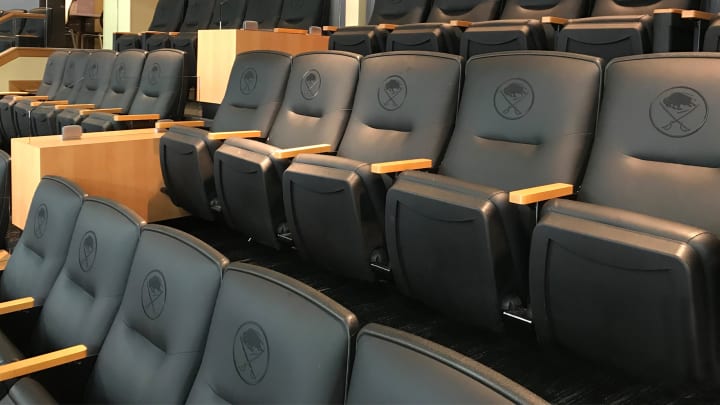 Photo from inside one of key bank center's suites showing the leather seats with Sabres logo on it
