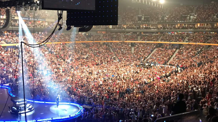 Photo of a concert inside key bank center with a full crowd