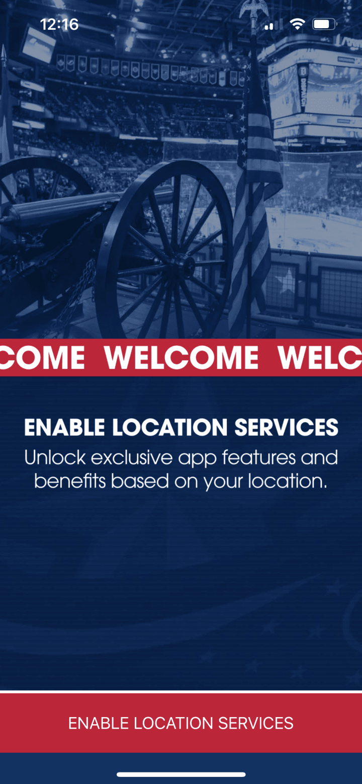 Screenshot of Enable Location Services loading screen on the Blue Jackets app. Blue graphic with white text reading Enable Location Services. Smaller white text below reads Unlock exclusive app features and benefits based on your location. Red button at bottom reads Enable Location Services.