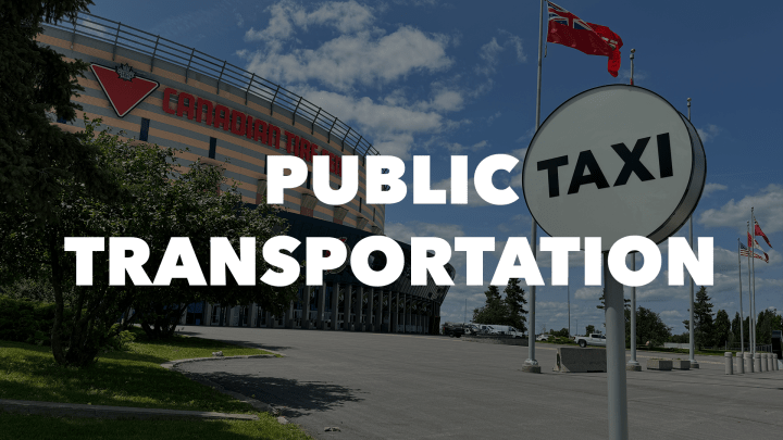 Image of a taxi sign outside the Canadian Tire Centre with the words "Public Transportation" in white letters.